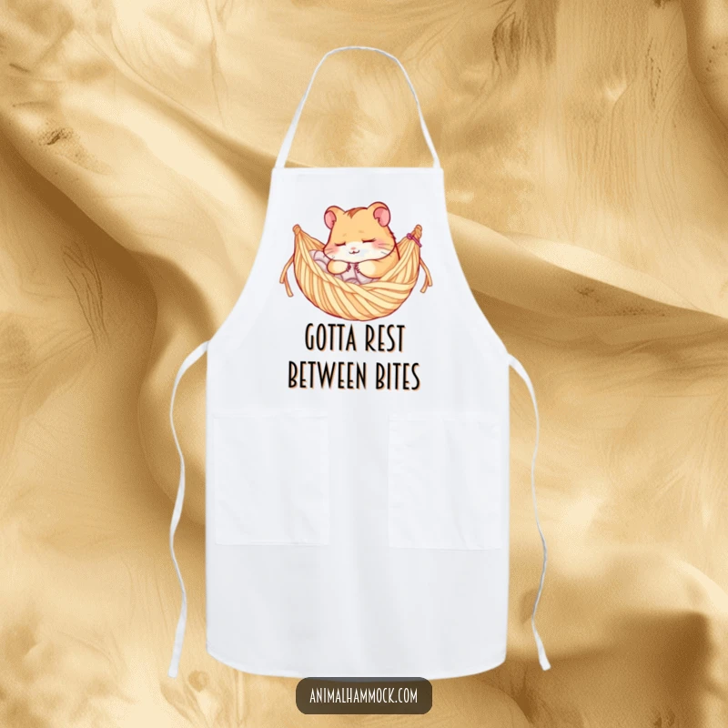 Funny apron illustrating a sleepy hamster character resting in a cozy yarn hammock, ready for kitchen duties with a smile.