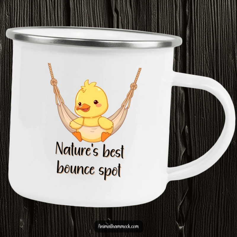 Funny duckling bouncing in a hammock on a durable camping mug, embodying outdoor joy and adventure.