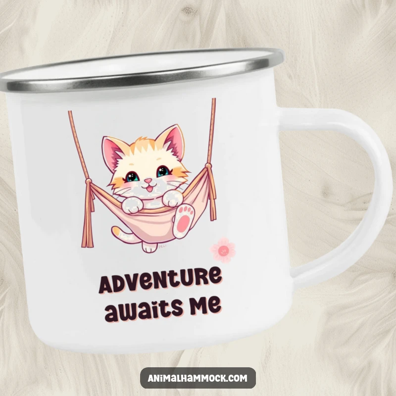 Funny kitten camping mug showing a playful kitten dangling from a hammock, ideal for outdoor excursions. Durable and humorous.