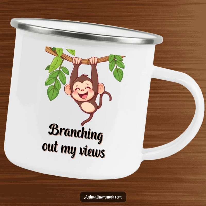 Funny monkey camping mug showcasing a giggling primate hanging upside down from a hammock, ideal for outdoor humor.