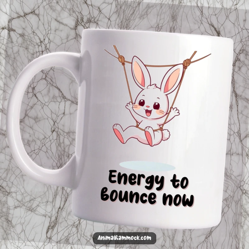 Funny mug featuring a playful bunny character joyfully dangling from a hammock, kicking its legs with pure delight and energy.