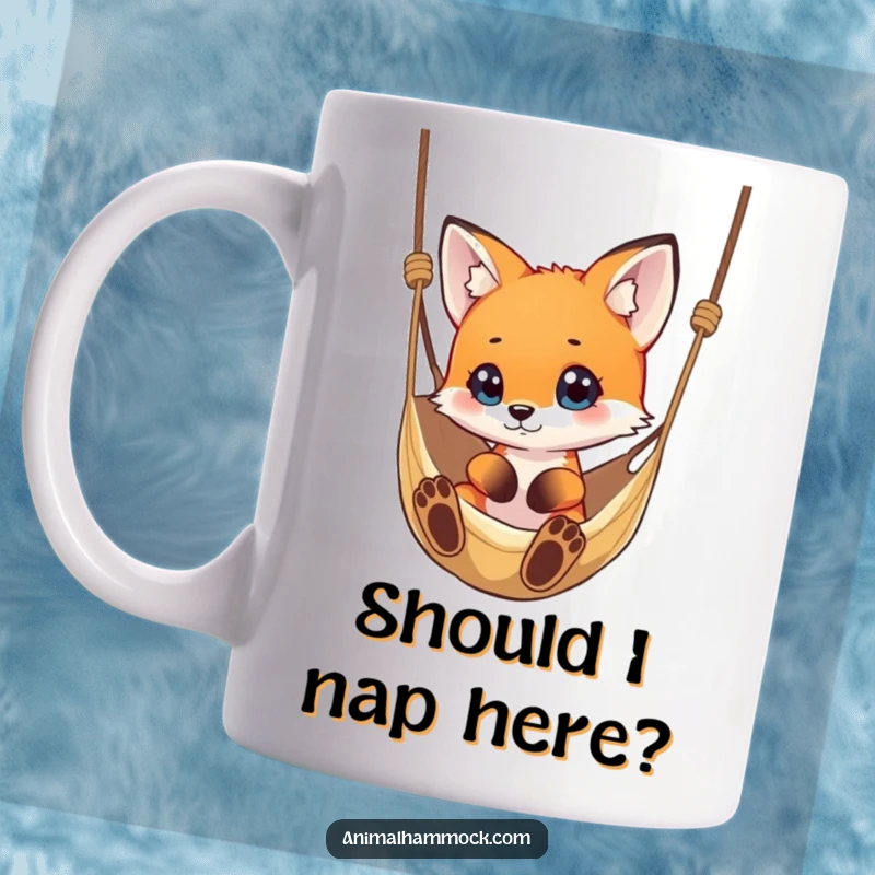 Funny small fox with wide, curious eyes looking at a dangling hammock, conveying playful intrigue on this witty mug.
