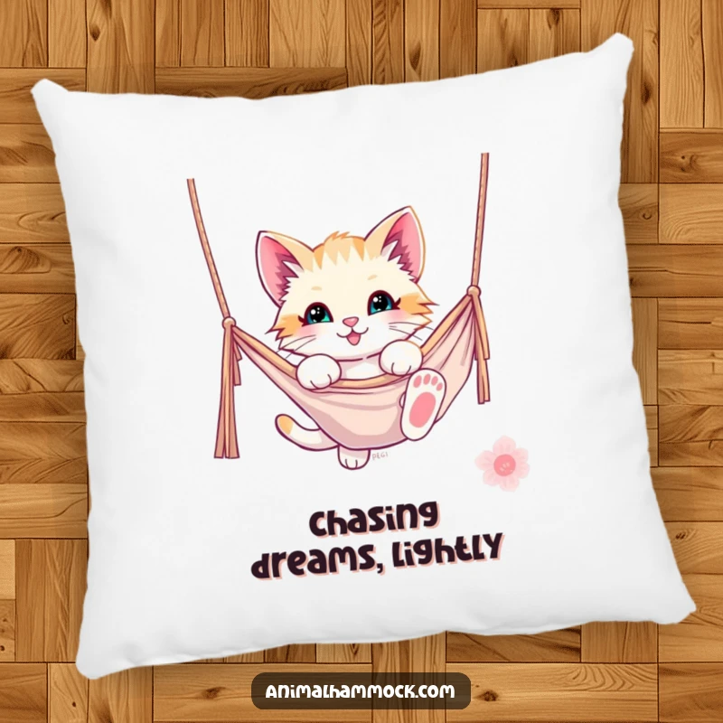 Funny kitten pillow featuring a playful kitten dangling from a hammock, providing comfort and a smile. A cute and funny decorative piece.