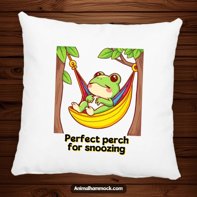 Funny, plush pillow showing a small frog relaxing in a brightly colored hammock, offering cozy comfort and a cheerful touch.