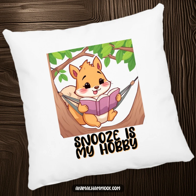 Funny, plush pillow featuring a squirrel reading a book in a hammock, offering cozy comfort and humorous decor.