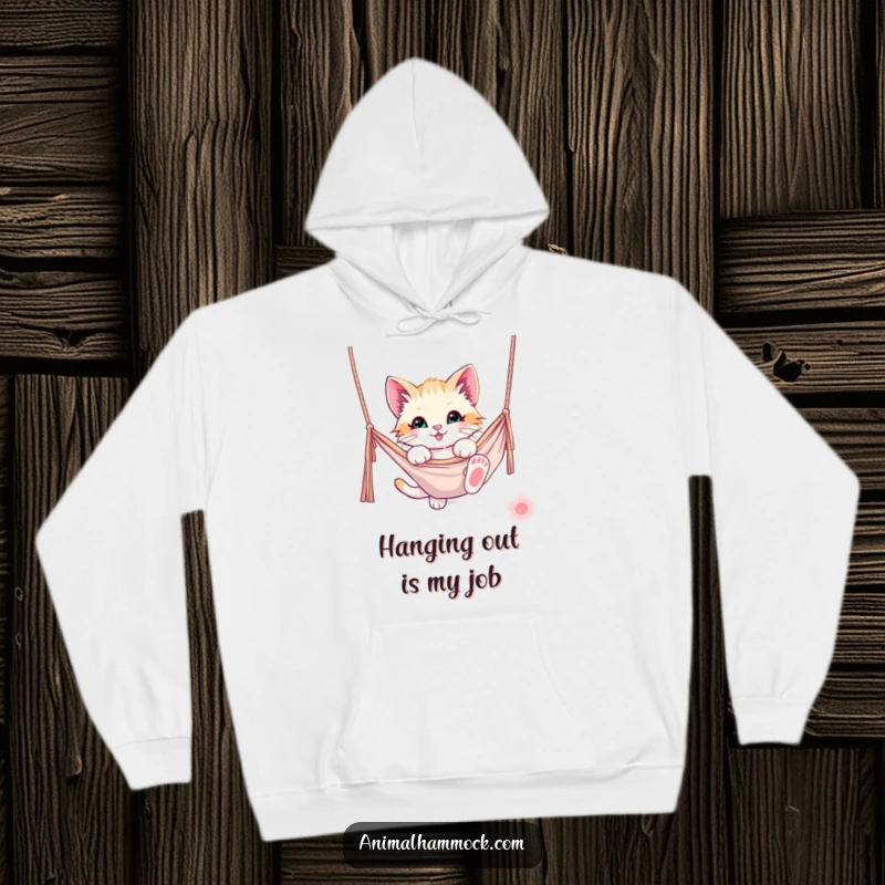 Funny kitten hoodie of a playful kitten hanging from a hammock, offering warmth and whimsical humor. A cozy and cute item.