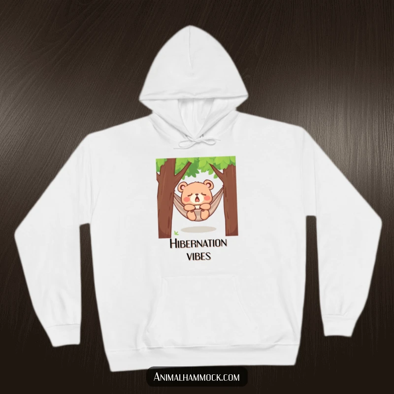 Funny yawning bear cub dozing in a hammock between trees, printed on a warm hoodie, radiating comfort, sleepiness, and adorable charm.