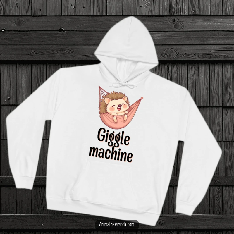 Funny hoodie depicting a happy hedgehog rolling into a hammock, combining coziness with adorable, humorous fun. Wonderful gift.
