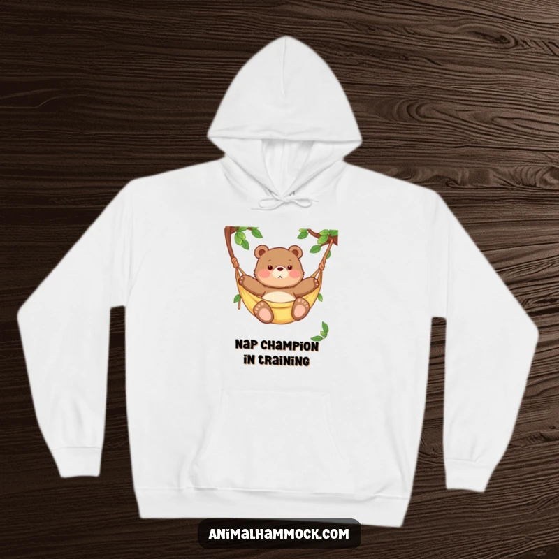 Funny chubby bear cub blissfully swaying in a hammock, captured on a soft hoodie for ultimate comfort and humorous appeal.