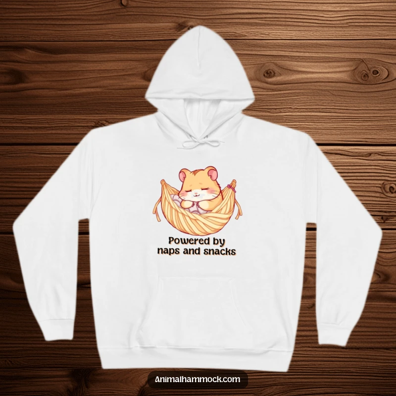 Funny hoodie showcasing a deeply asleep hamster character snoozing soundly in a knitted yarn hammock, embodying ultimate comfort.