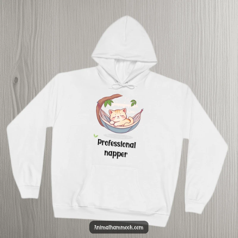 Funny sleepy cat dreaming peacefully in a hammock oasis, printed on a warm hoodie, radiating comfort, peace, and serene charm.