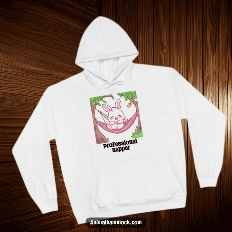 Funny Bunny Hoodie displaying a fluffy character gleefully bouncing while napping in a hammock, symbolizing ultimate cozy relaxation and joy.
