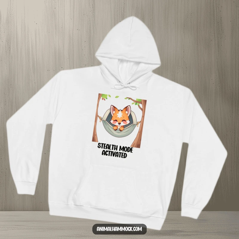 Funny fox peeking from a cozy hammock, printed on a warm hoodie, depicting a sense of playful curiosity and ultimate relaxation, a funny wearable.