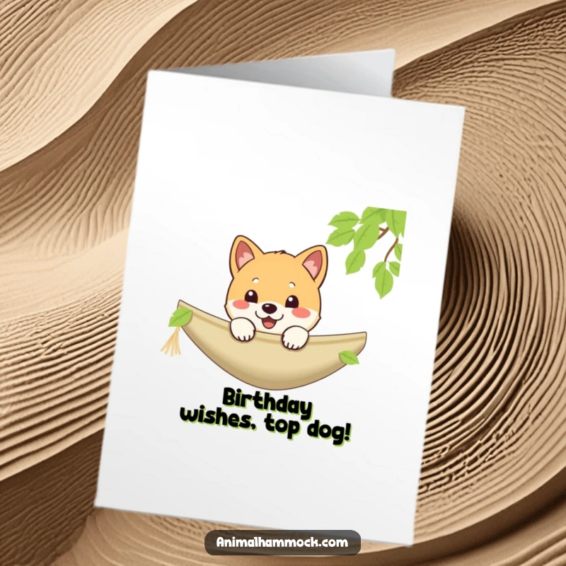 Funny Free Printable Birthday Card: A cute Shiba puppy peeking over the edge of a hammock with a cheerful grin.