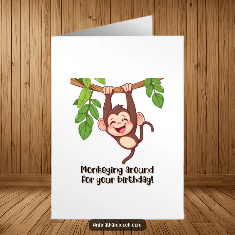 Funny Free Printable Birthday Card: Giggling monkey hanging upside down in a hammock, spreading joy and laughter for a special celebration.