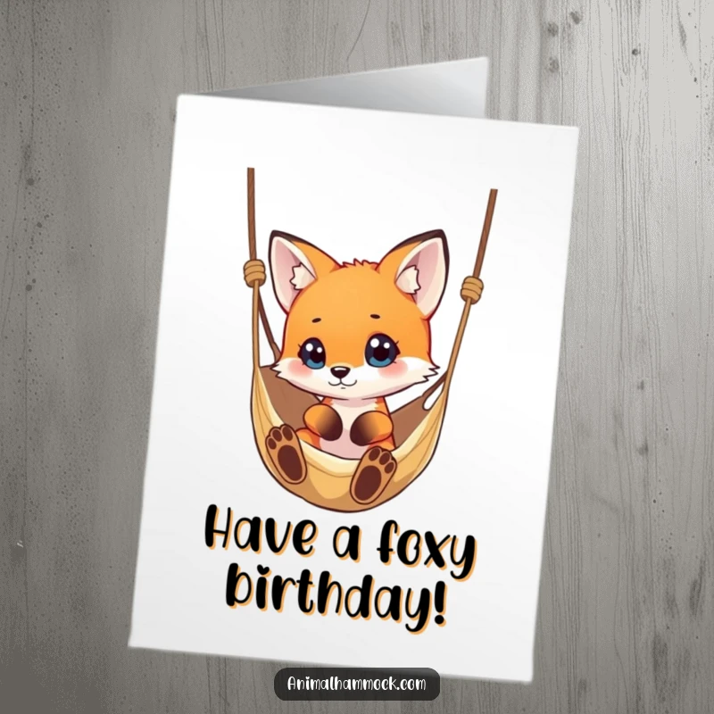 Funny Free Printable Birthday Card: A small fox curiously looking at a dangling hammock, perfect for a quirky birthday wish.