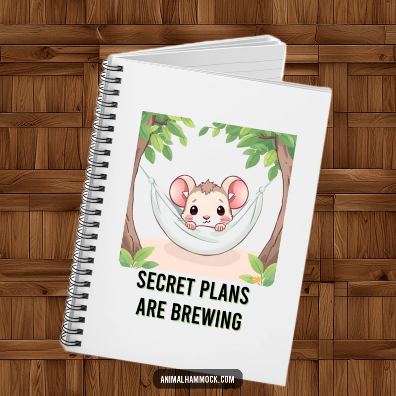 Funny mouse character peeking from under a hammock blanket, featured on a notebook cover for curious minds.