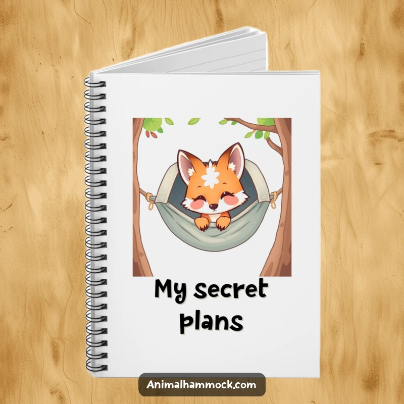 Funny curious fox peeking from a hammock, printed on a notebook cover, inspiring creativity and offering a humorous touch for note-taking.