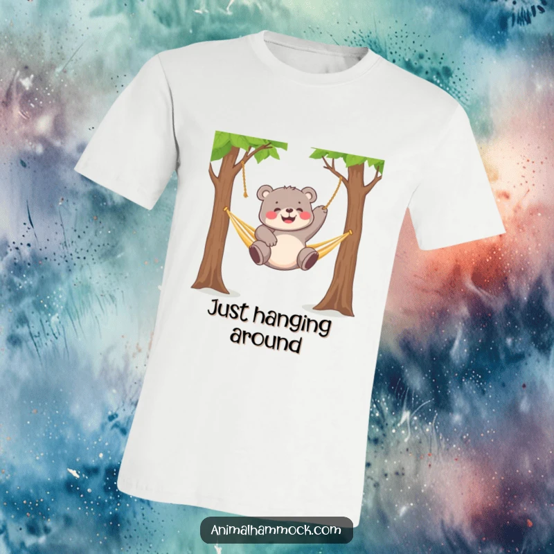Funny chubby bear cub gleefully dangling from a hammock strung between two trees, printed on a t-shirt.